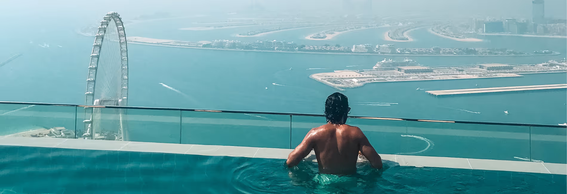 Nas at the edge of the infinity pool in Address Beach Resort Dubai